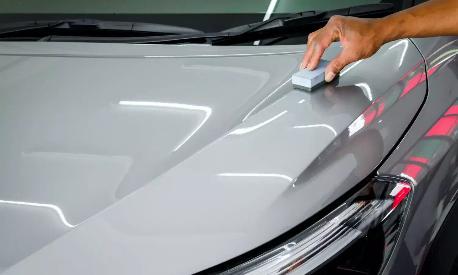 Applying Ceramic Coating On Grey Vehicle For Protection