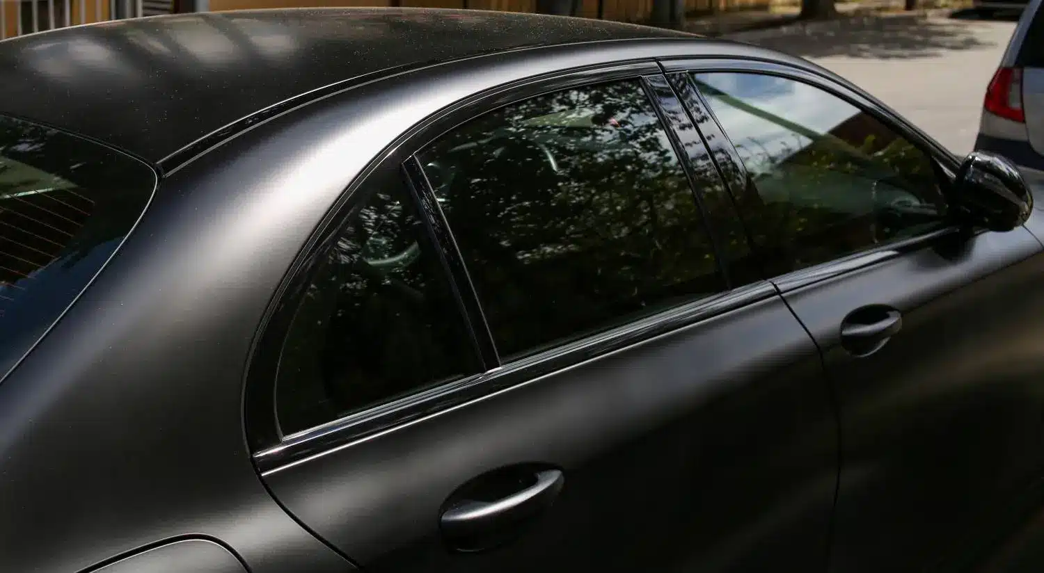 Black Car With Tinted Windows to Protect the Interior From UV Damage